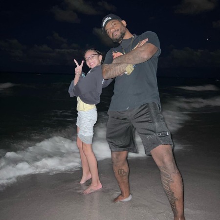 Bryson Tiller and her daughter Harley Loraine Tiller posed on beach.
